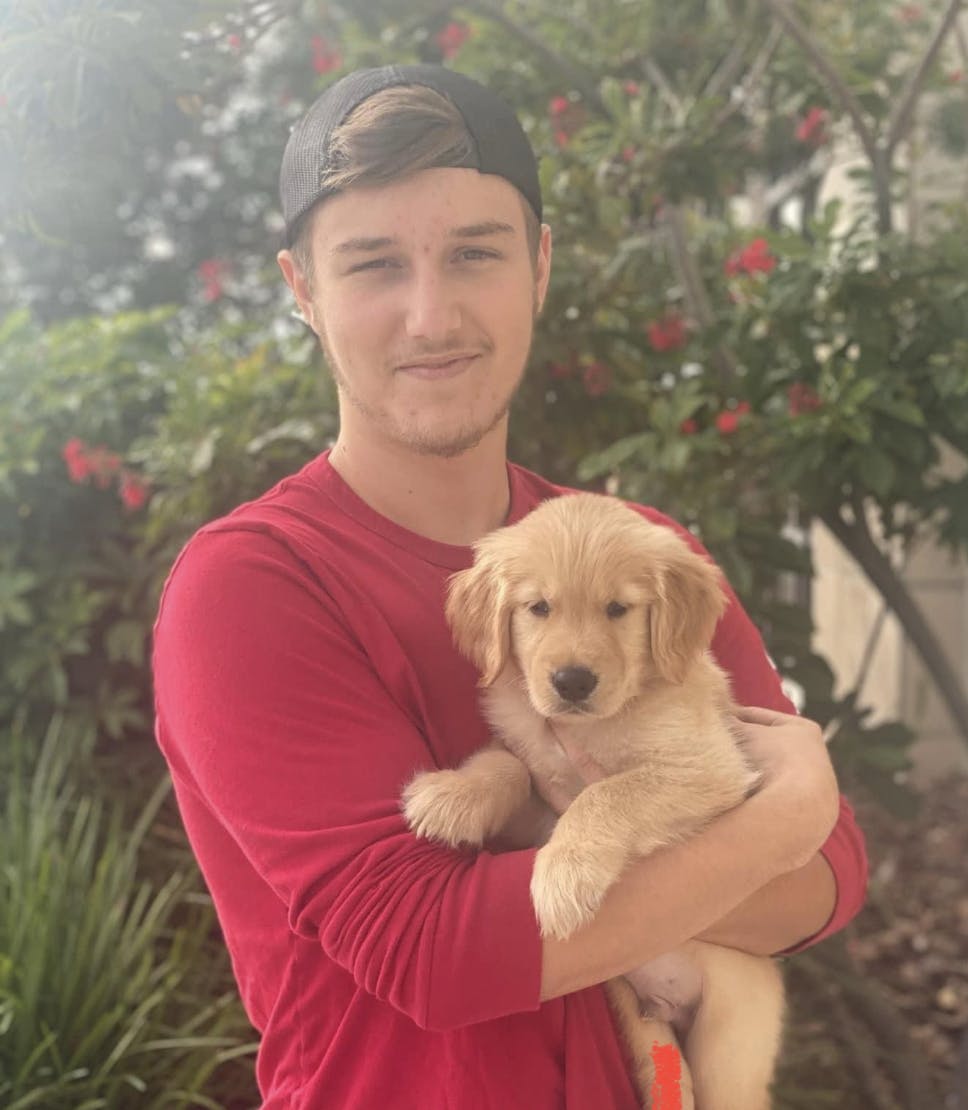 Staff Member Tanner and puppy